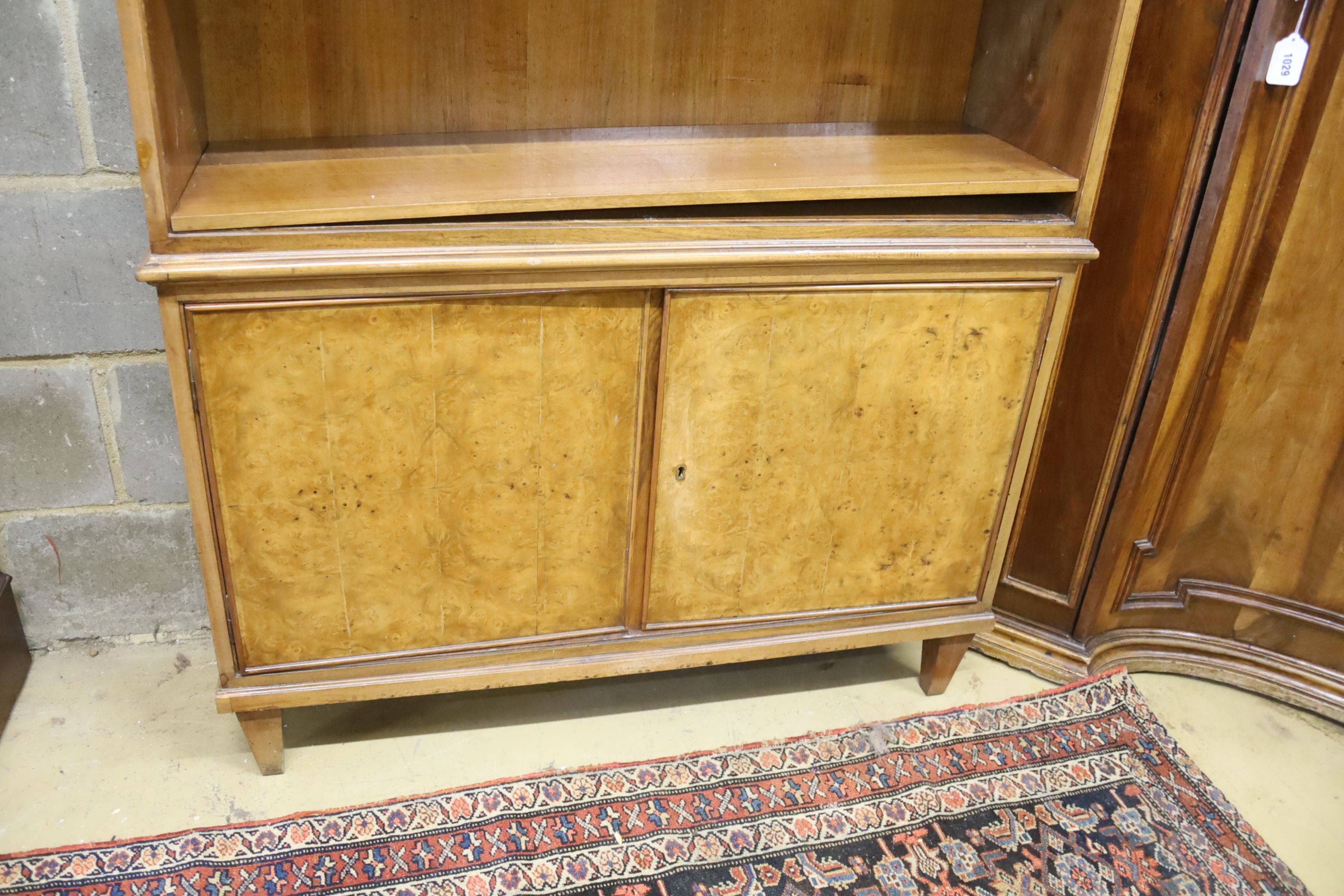 A mid century walnut open bookcase, width 102cm, depth 31cm, height 220cm